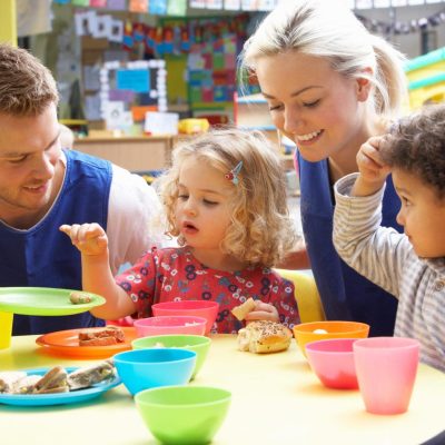 Couple and children playing with toys
